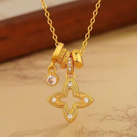 Gold shiny zirconium hollow four-leaf clover pendant necklace for women light luxury niche high-end sweater chain accessories long neck chain